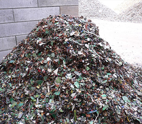 Close-up image of a pile of recycling material featuring various colours