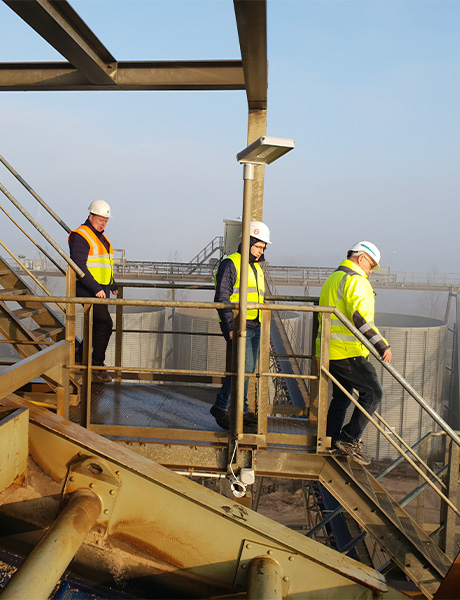 Employees inspecting a plant