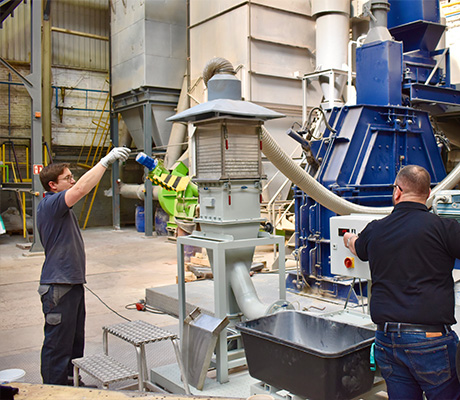 Two allmineral employees inspecting a plant