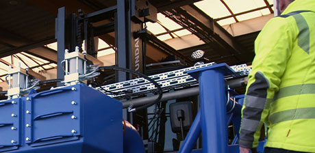 Focused employee looking at plant